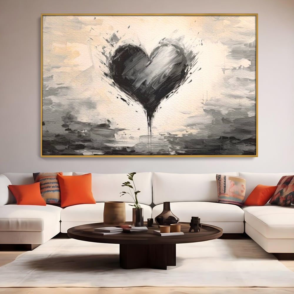 Tablou canvas cu tablou abstract cu inima neagra, in rama de aluminiu auriu, pe perete intr-un living