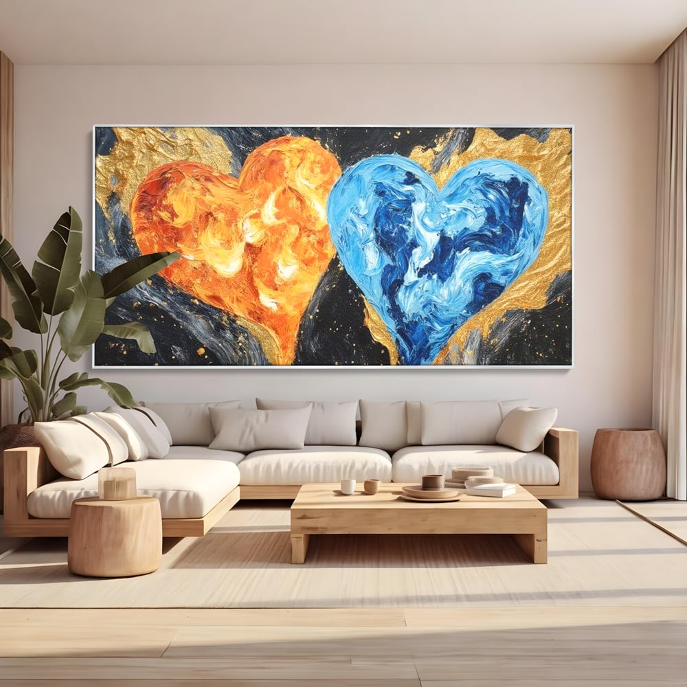 Tablou canvas cu pictura cu doua inimi simbolice, in rama de aluminiu argintiu, pe perete intr-un living