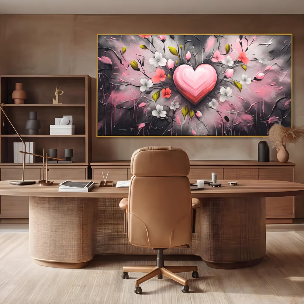 Tablou canvas cu tablou canvas cu inima roz si flori, in rama de aluminiu auriu, pe perete intr-un birou