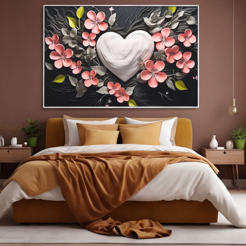 Tablou canvas cu tablou canvas cu inima alba si flori roz, in rama de aluminiu argintiu, pe perete intr-un dormitor