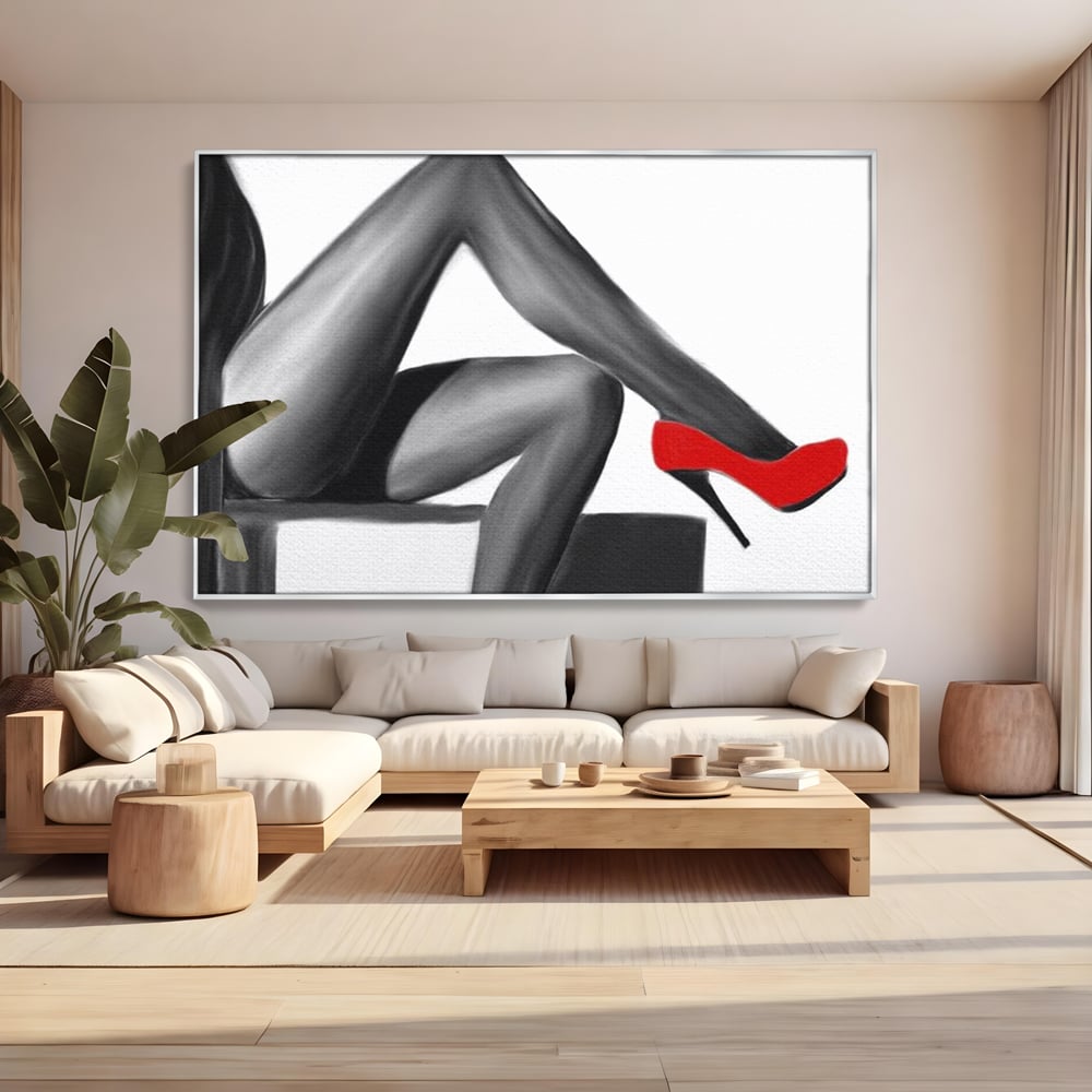 Tablou canvas cu illustratie alb negru cu picioare si pantof rosu, in rama de aluminiu argintiu, pe perete intr-un living