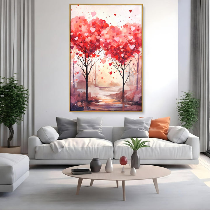 Tablou canvas cu tablou canvas cu doi copaci in forma de inimi, in rama de aluminiu auriu, pe perete intr-un living