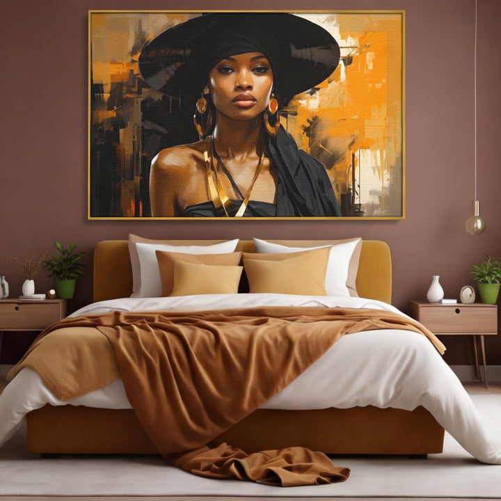 Tablou canvas cu tablou canvas cu femeie in palarie neagra, in rama de aluminiu auriu, pe perete intr-un dormitor