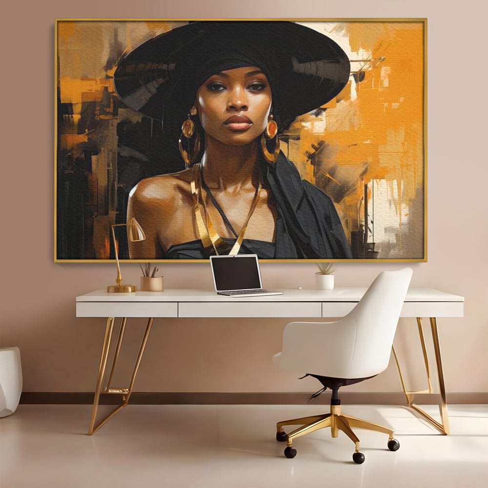 Tablou canvas cu tablou canvas cu femeie in palarie neagra, in rama de aluminiu auriu, pe perete intr-un birou