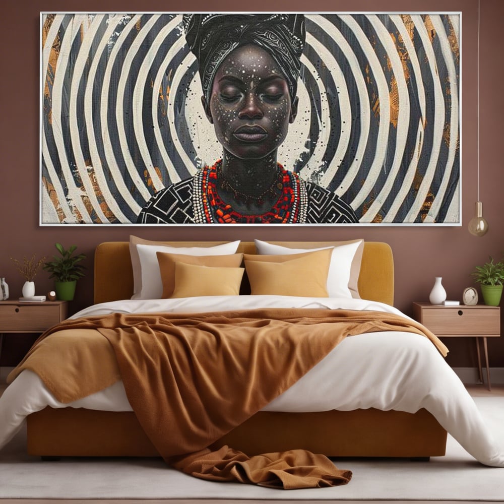 Tablou canvas cu tablou canvas cu regina africana, in rama de aluminiu argintiu, pe perete intr-un dormitor