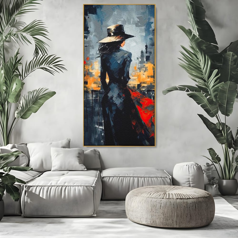 Tablou canvas cu tablou canvas cu femeie in palarie si oras, in rama de aluminiu auriu, pe perete intr-un living