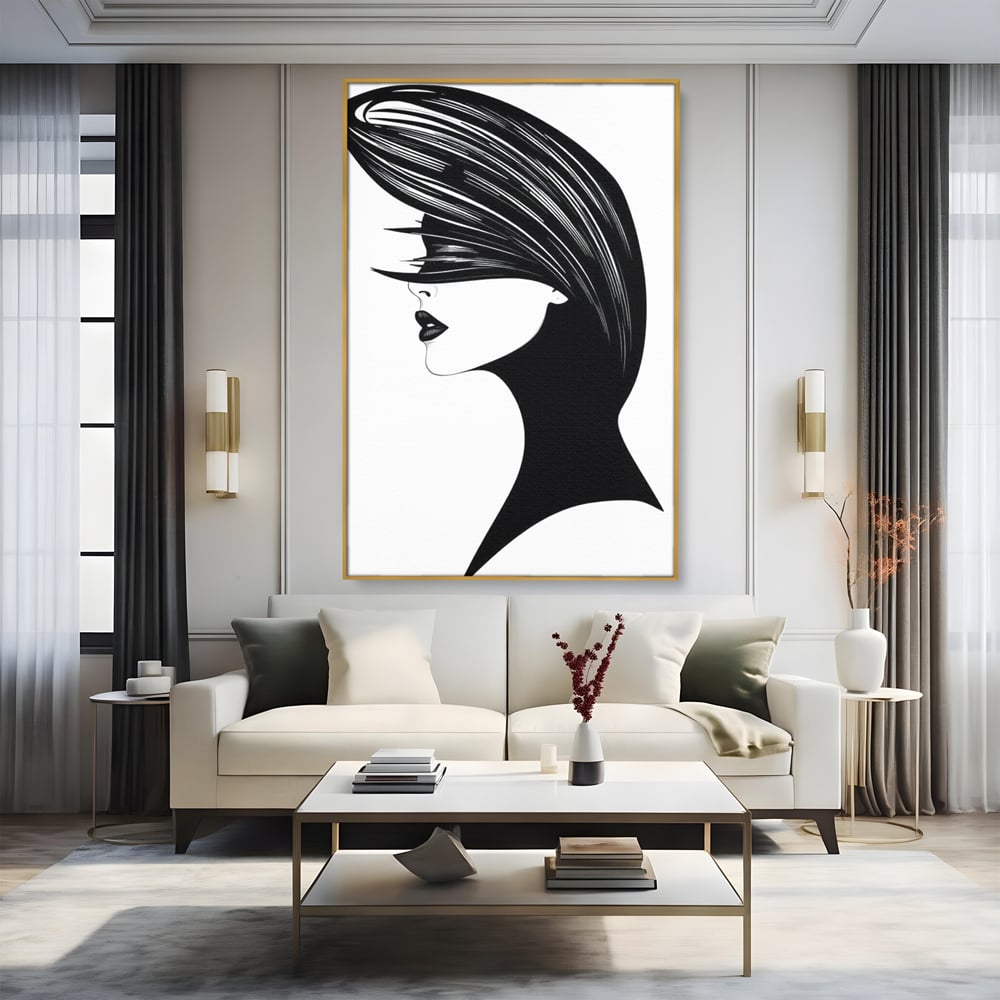 Tablou canvas cu ilustratie cu profil de femeie in alb si negru, in rama de aluminiu auriu, pe perete intr-un living