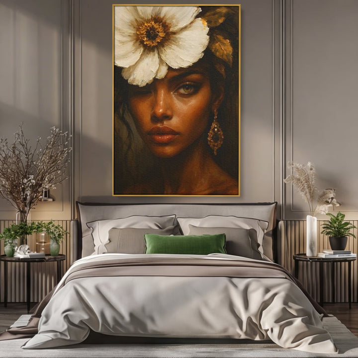 Tablou canvas cu tablou canvas cu portret de femeie si floare alba, in rama de aluminiu auriu, pe perete intr-un dormitor
