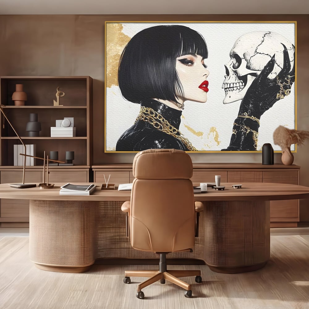 Tablou canvas cu ilustratie digitala cu femeie si craniu, in rama de aluminiu auriu, pe perete intr-un birou