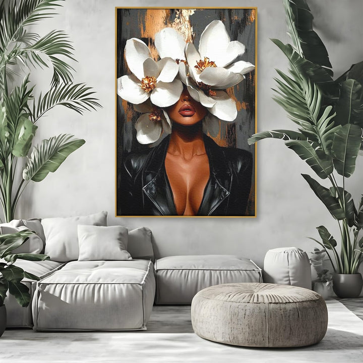 Tablou canvas cu tablou canvas cu femeie si magnolii, in rama de aluminiu auriu, pe perete intr-un living