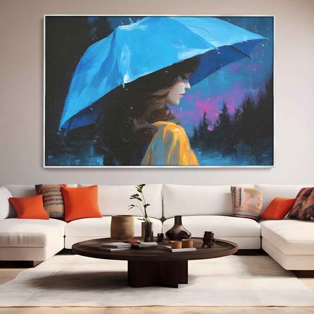 Tablou canvas cu pictura cu femeie sub umbrela albastra, in rama de aluminiu argintiu, pe perete intr-un living