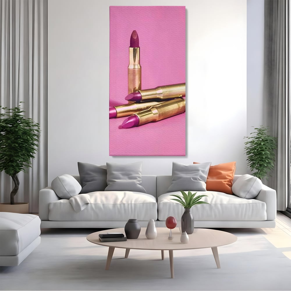 Tablou canvas cu tablou canvas cu rujuri in forme de cartuse pe fond roz, fara rama, pe sasiu de lemn, pe perete intr-un living