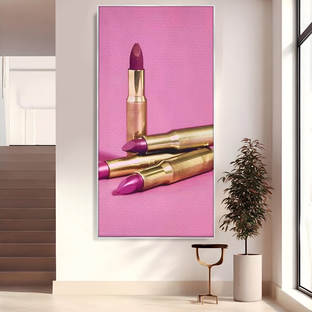 Tablou canvas cu tablou canvas cu rujuri in forme de cartuse pe fond roz, in rama de aluminiu argintiu