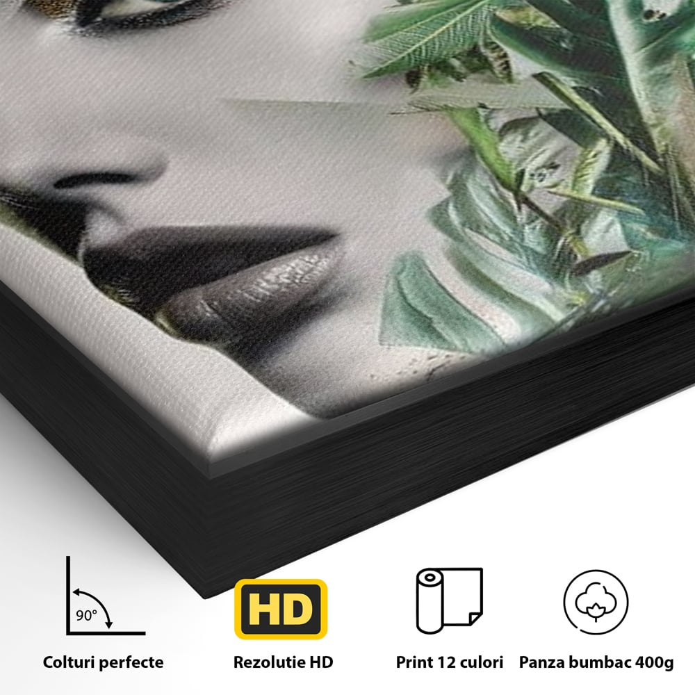Detaliu al suprafetei: tablou canvas cu portret de femeie si frunze tropicale, in rama de aluminiu negru