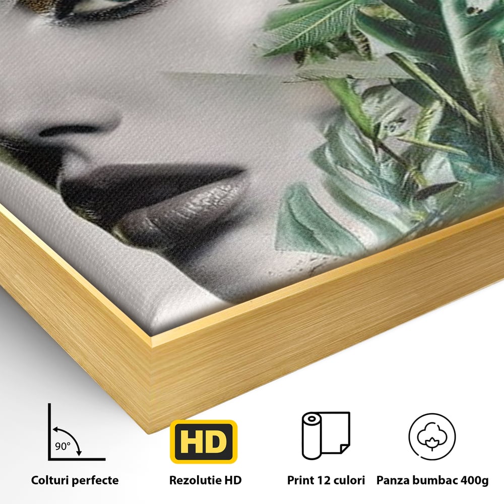 Detaliu al suprafetei: tablou canvas cu portret de femeie si frunze tropicale, in rama de aluminiu auriu