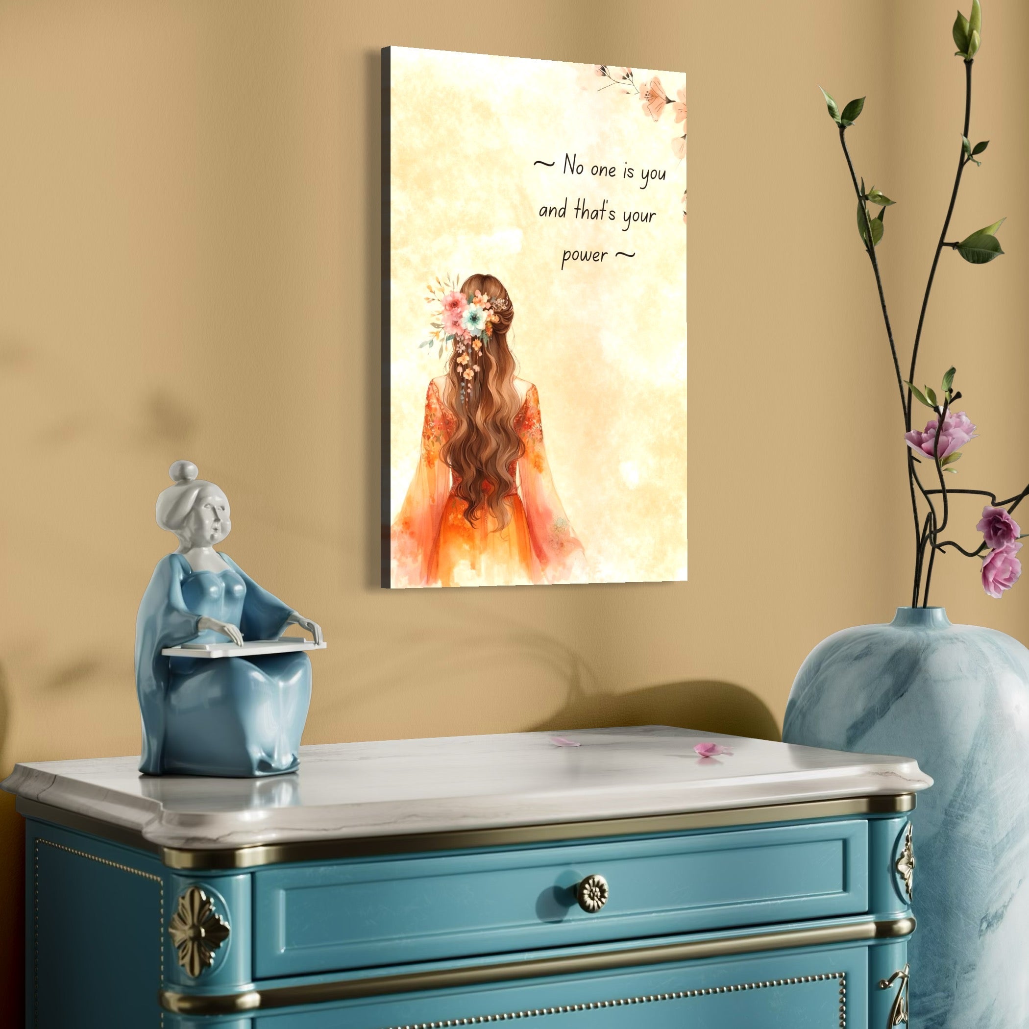 tablou canvas cu o femeie cu parul decorat cu flori, pe fundal deschis bej cu mesaj motivational