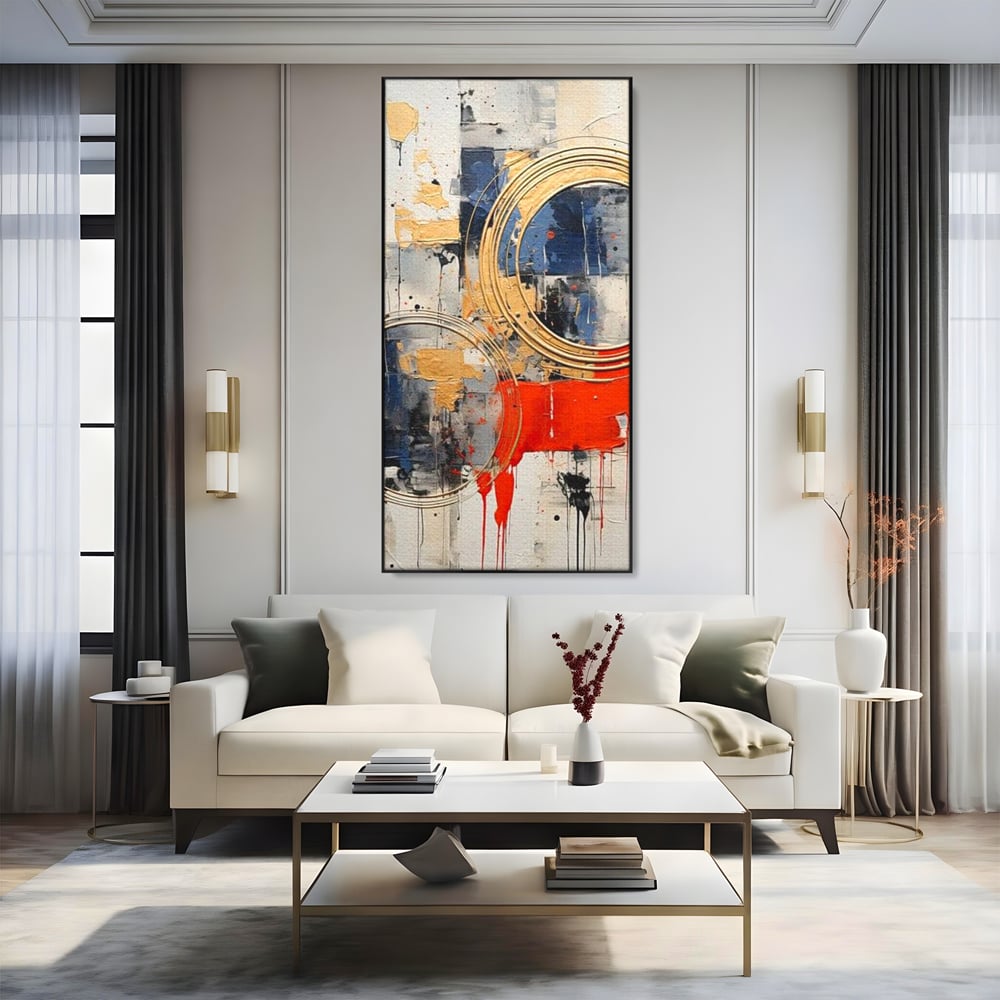 Tablou canvas cu tablou abstract cu cercuri aurii si tuse rosu aprins, in rama de aluminiu negru, pe perete intr-un living