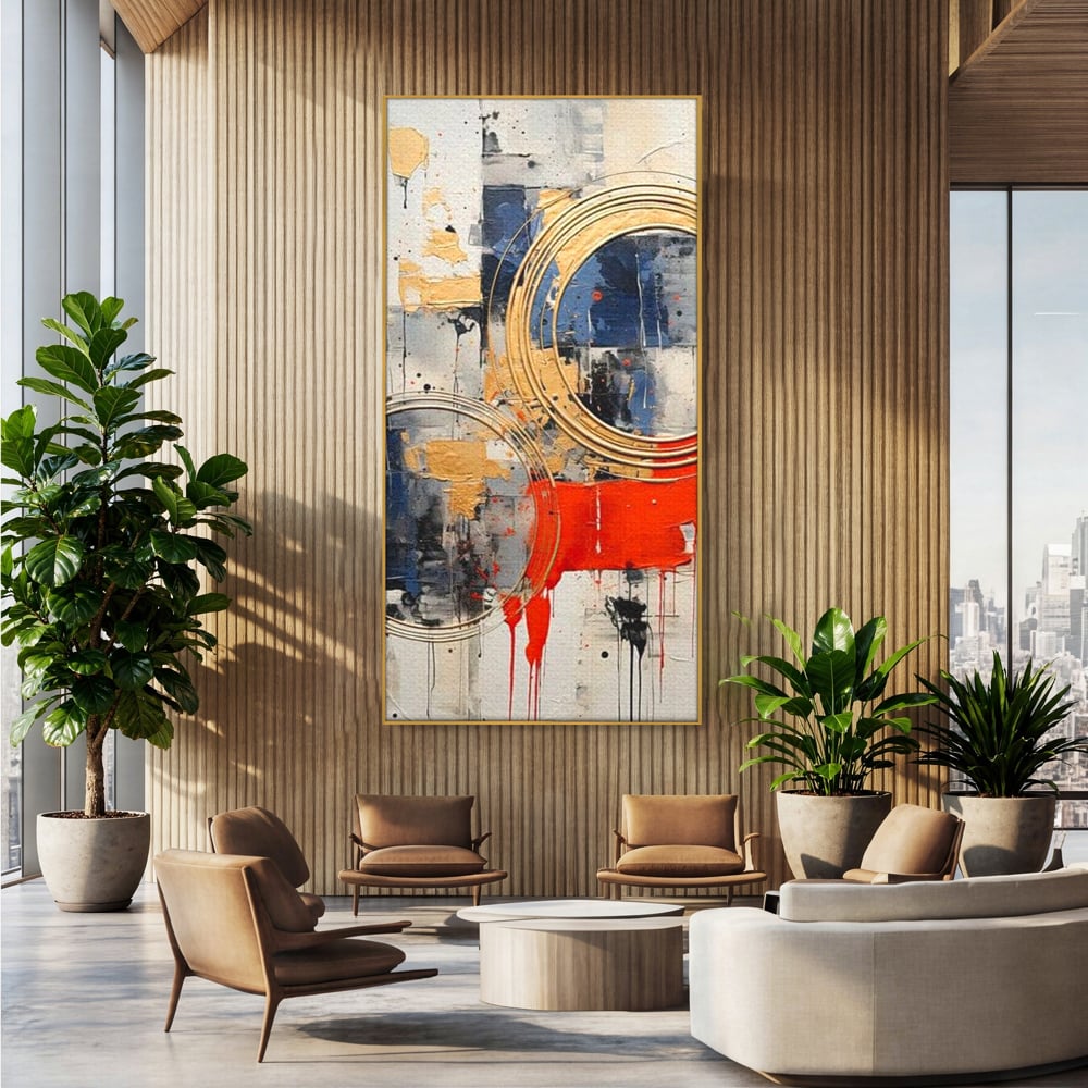 Tablou canvas cu tablou abstract cu cercuri aurii si tuse rosu aprins, in rama de aluminiu auriu, pe perete intr-un birou