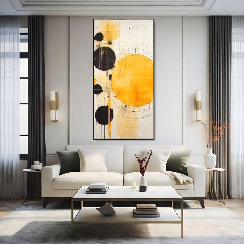 Tablou canvas cu tablou canvas cu cercuri galbene si negre, in rama de aluminiu negru, pe perete intr-un living