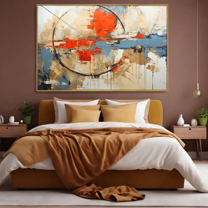 Tablou canvas cu pictura abstracta cu cerc negru si pete rosii, in rama de aluminiu auriu, pe perete intr-un dormitor