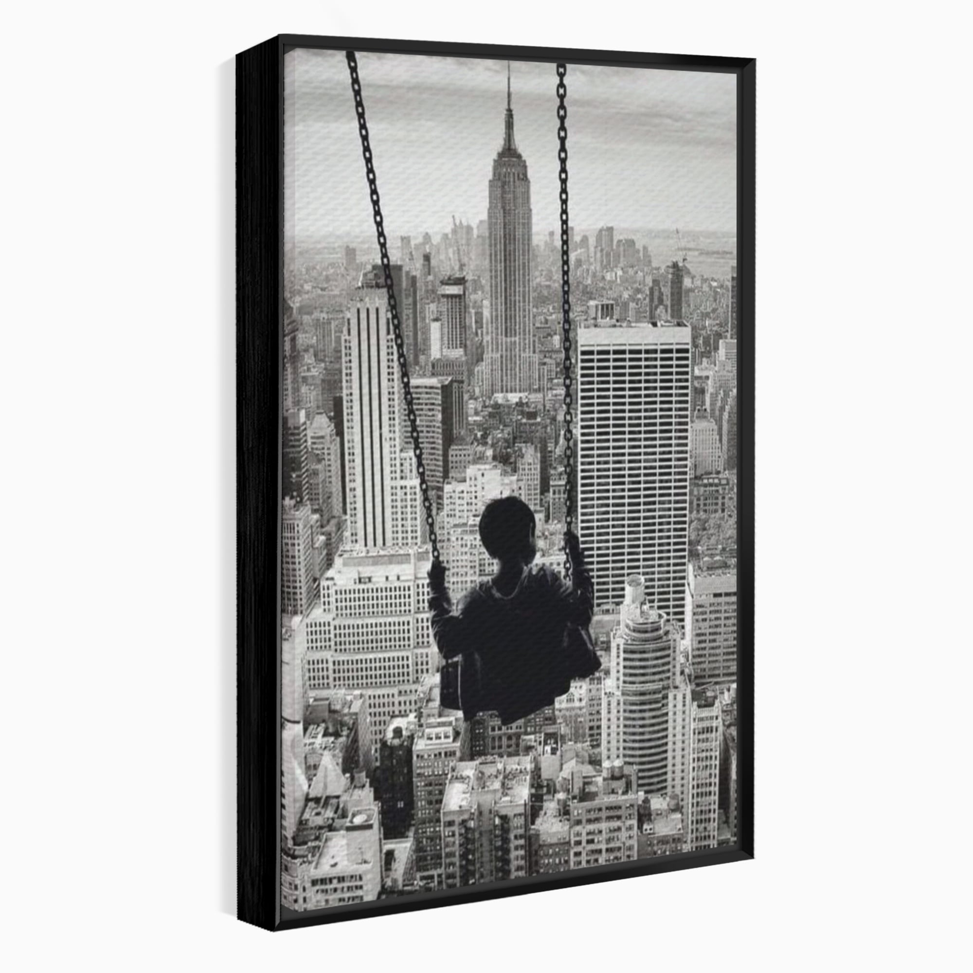 Tablou canvas cu tablou canvas cu copil in leagan deasupra orasului, in rama de aluminiu negru