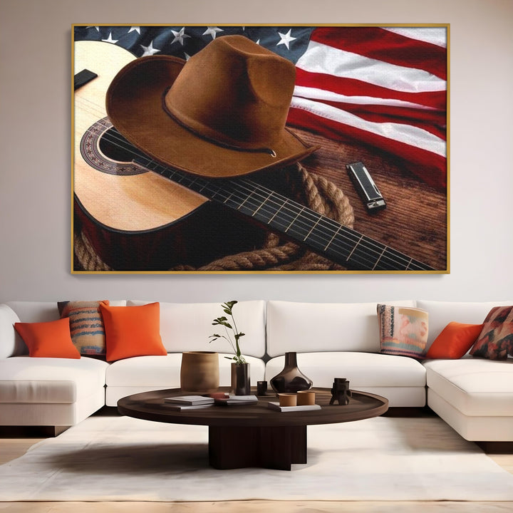 Tablou canvas cu tablou canvas cu palarie, chitara si drapel american, in rama de aluminiu auriu, pe perete intr-un living