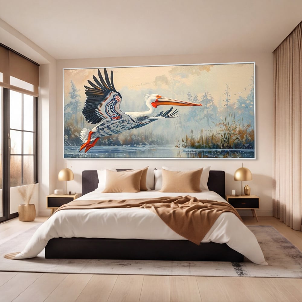 Tablou canvas cu tablou canvas cu pelican in zbor, in rama de aluminiu argintiu, pe perete intr-un dormitor