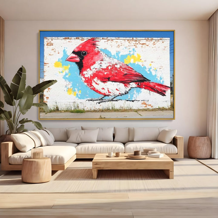 Tablou canvas cu tablou canvas cu pasare cardinal pe perete de caramida, in rama de aluminiu auriu, pe perete intr-un living