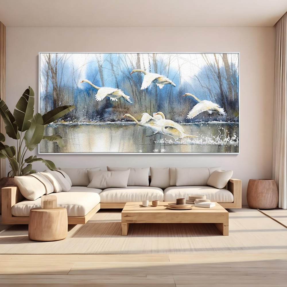 Tablou canvas cu pictura cu lebede pe apa, in rama de aluminiu argintiu, pe perete intr-un living