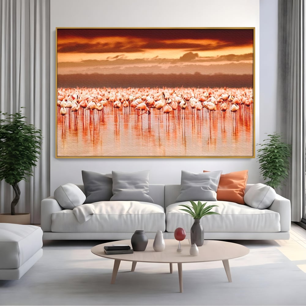 Tablou canvas cu tablou canvas cu stol de flamingo la apus, in rama de aluminiu auriu, pe perete intr-un living