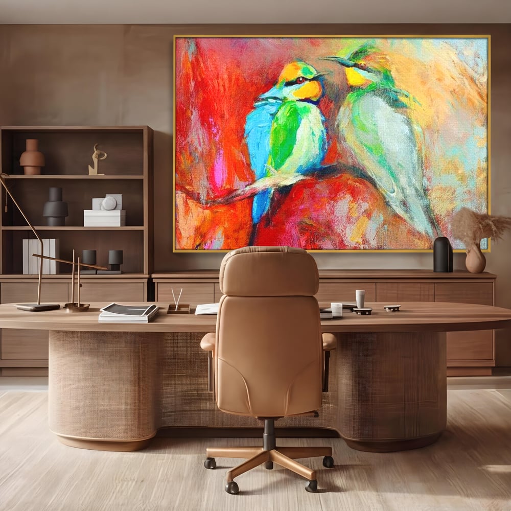 Tablou canvas cu tablou canvas cu doua pasari colorate pe creanga, in rama de aluminiu auriu, pe perete intr-un birou