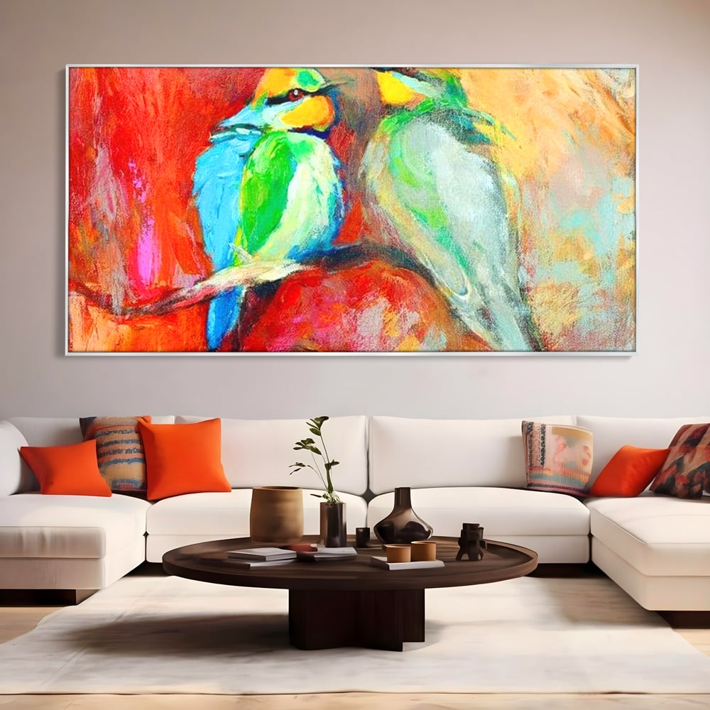 Tablou canvas cu tablou canvas cu doua pasari colorate pe creanga, in rama de aluminiu argintiu, pe perete intr-un living