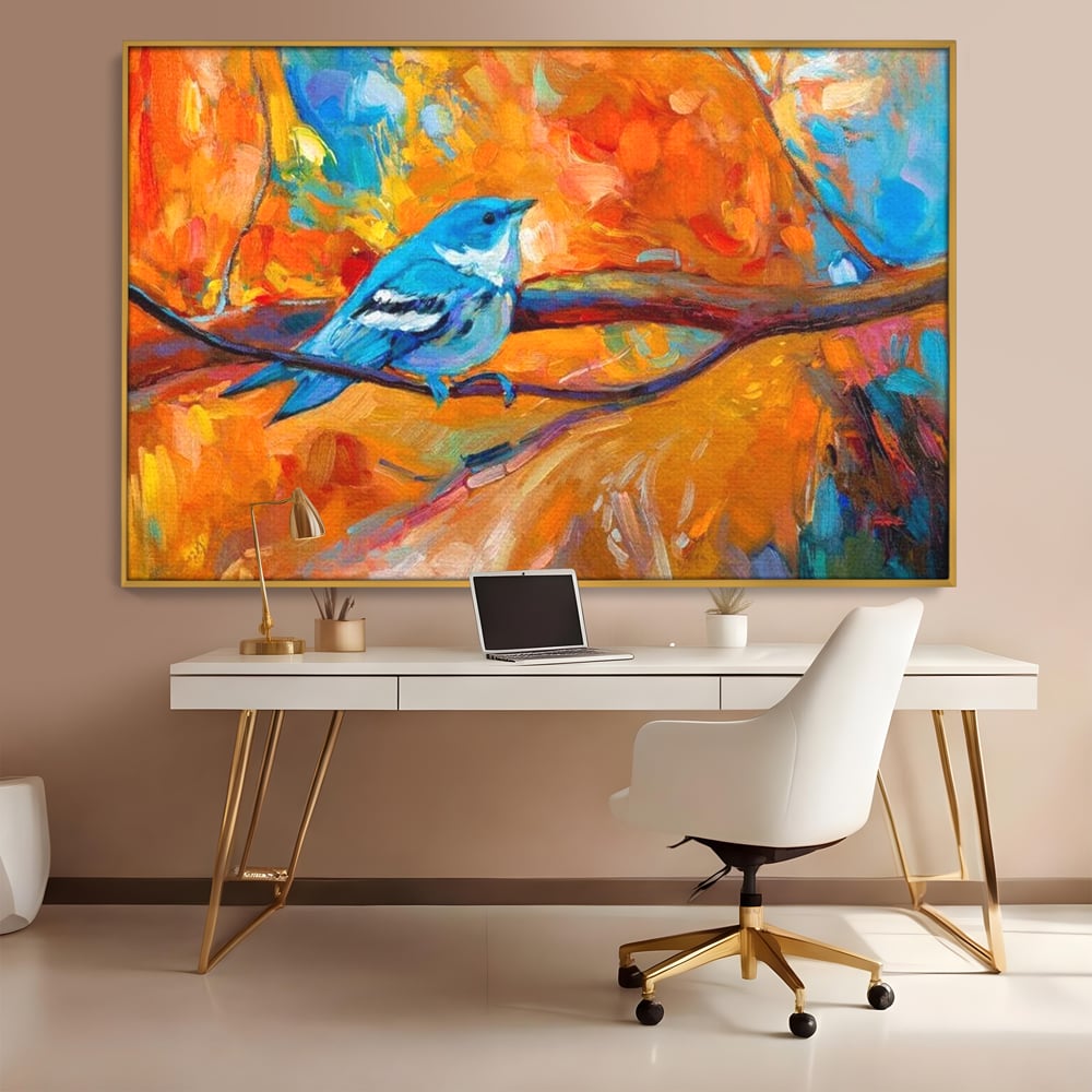 Tablou canvas cu tablou canvas cu pasare albastra pe ramura, in rama de aluminiu auriu, pe perete intr-un birou