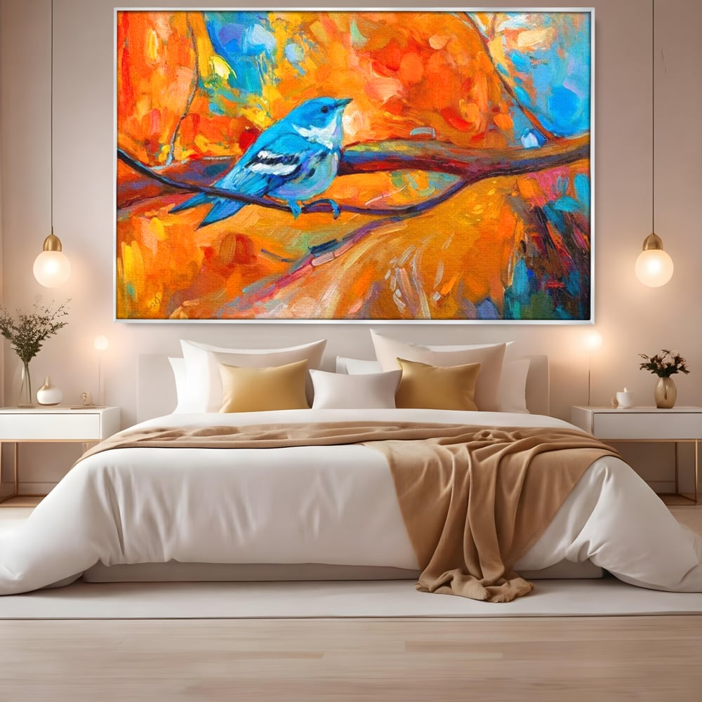 Tablou canvas cu tablou canvas cu pasare albastra pe ramura, in rama de aluminiu argintiu, pe perete intr-un dormitor