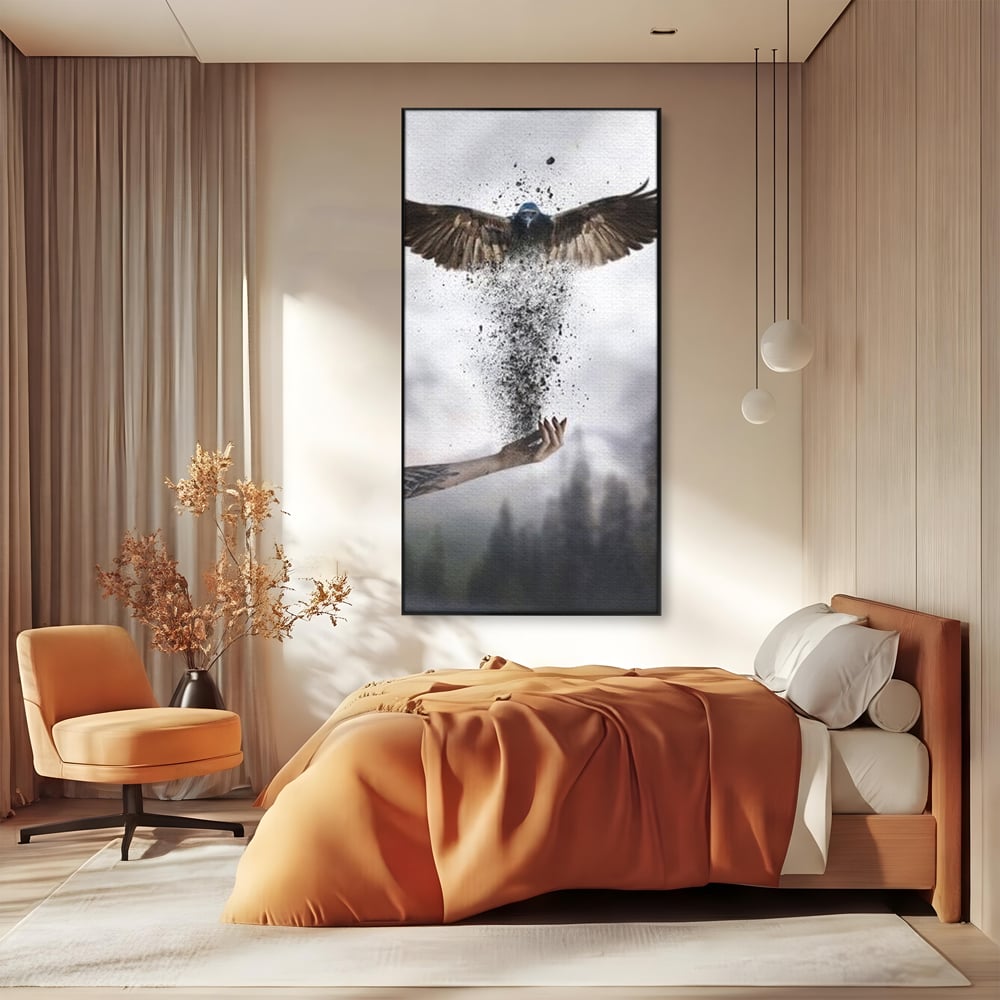 Tablou canvas cu tablou canvas cu pasare si mana din cenusa, in rama de aluminiu negru, pe perete intr-un dormitor