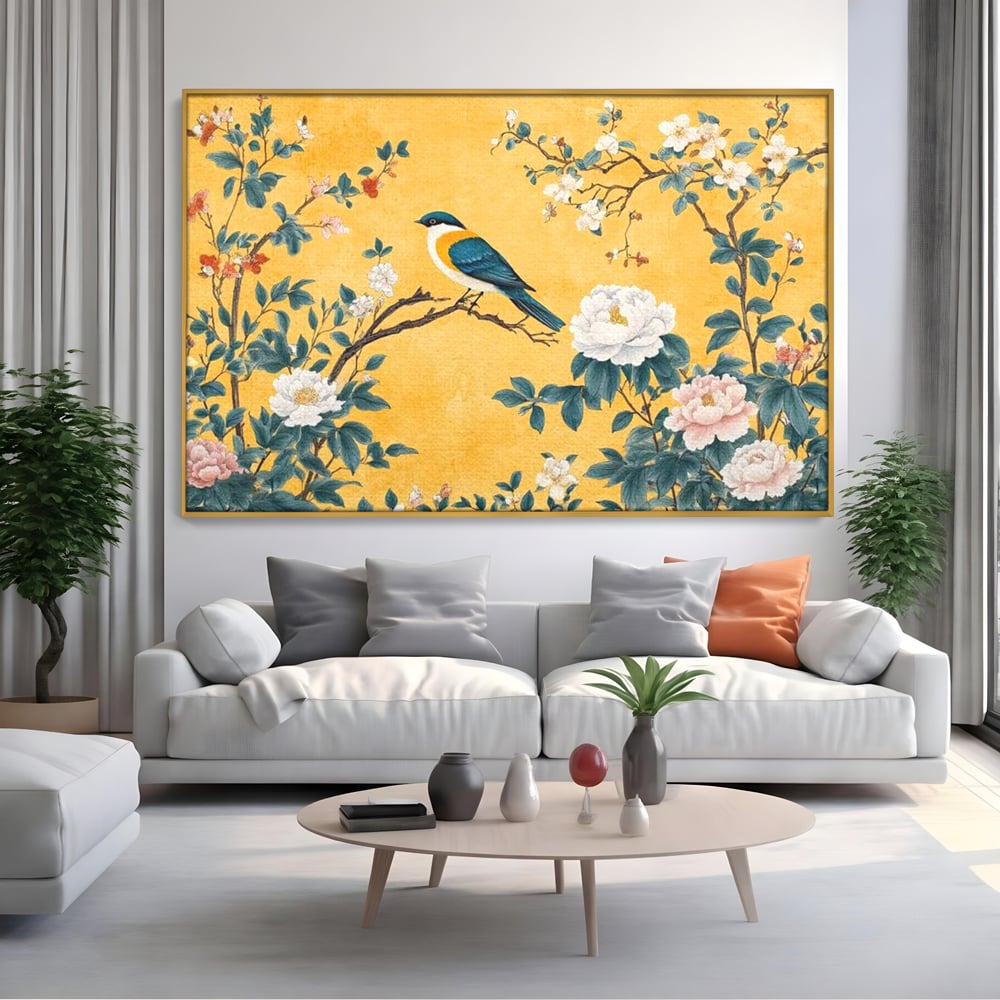 Tablou canvas cu tablou canvas cu pasare pe creanga si bujori, in rama de aluminiu auriu, pe perete intr-un living