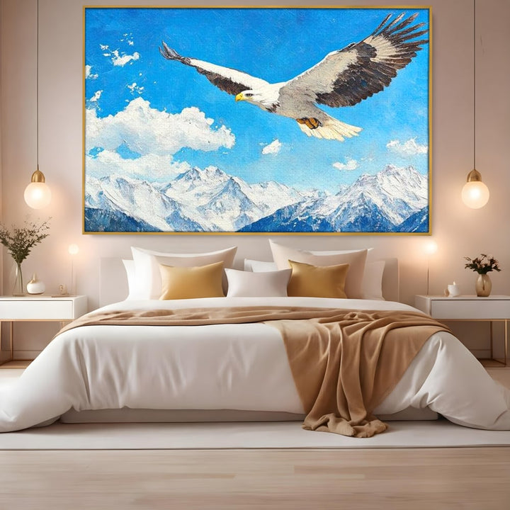 Tablou canvas cu tablou canvas cu vultur in zbor deasupra muntilor, in rama de aluminiu auriu, pe perete intr-un dormitor