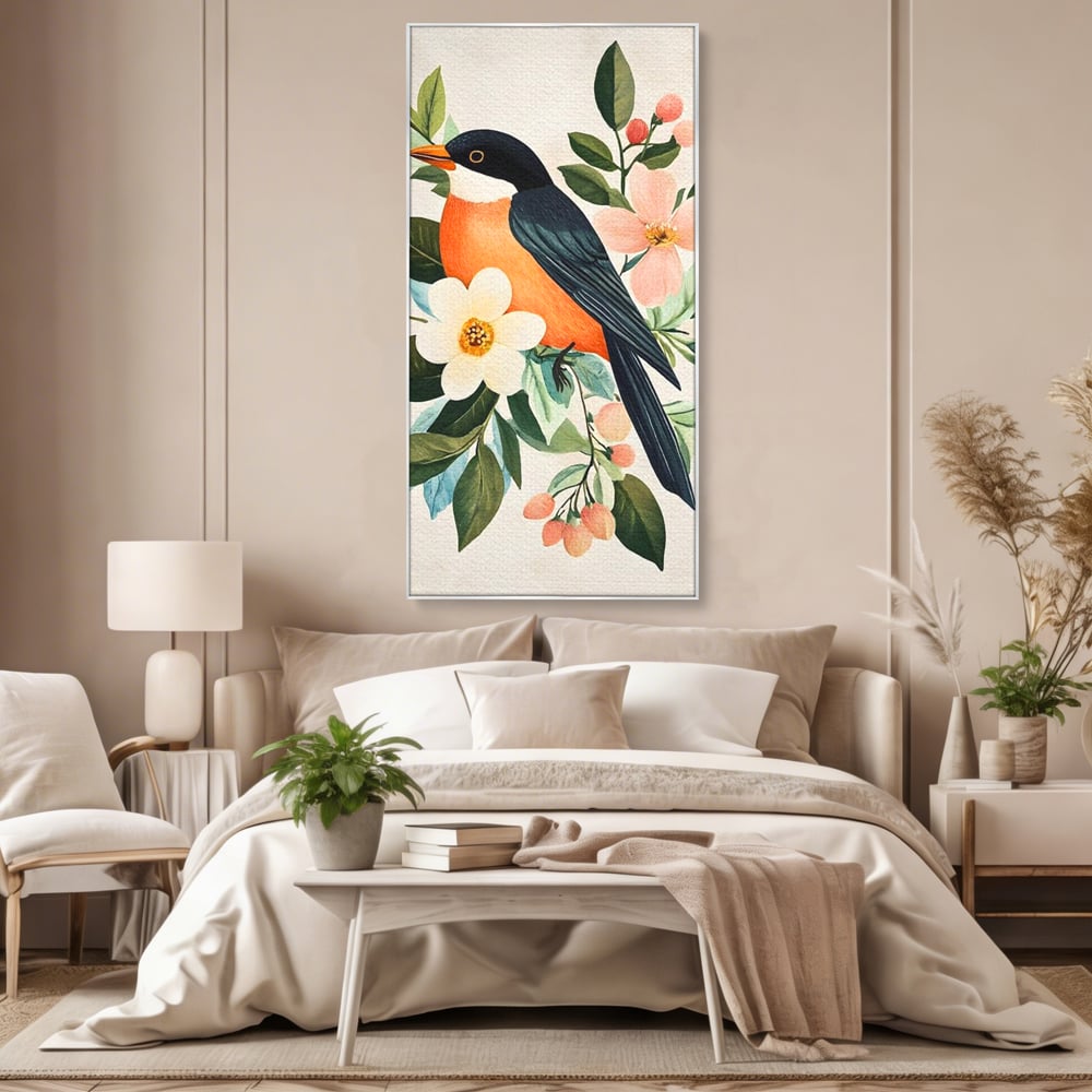 Tablou canvas cu tablou canvas cu pasare portocalie si flori, in rama de aluminiu argintiu, pe perete intr-un dormitor