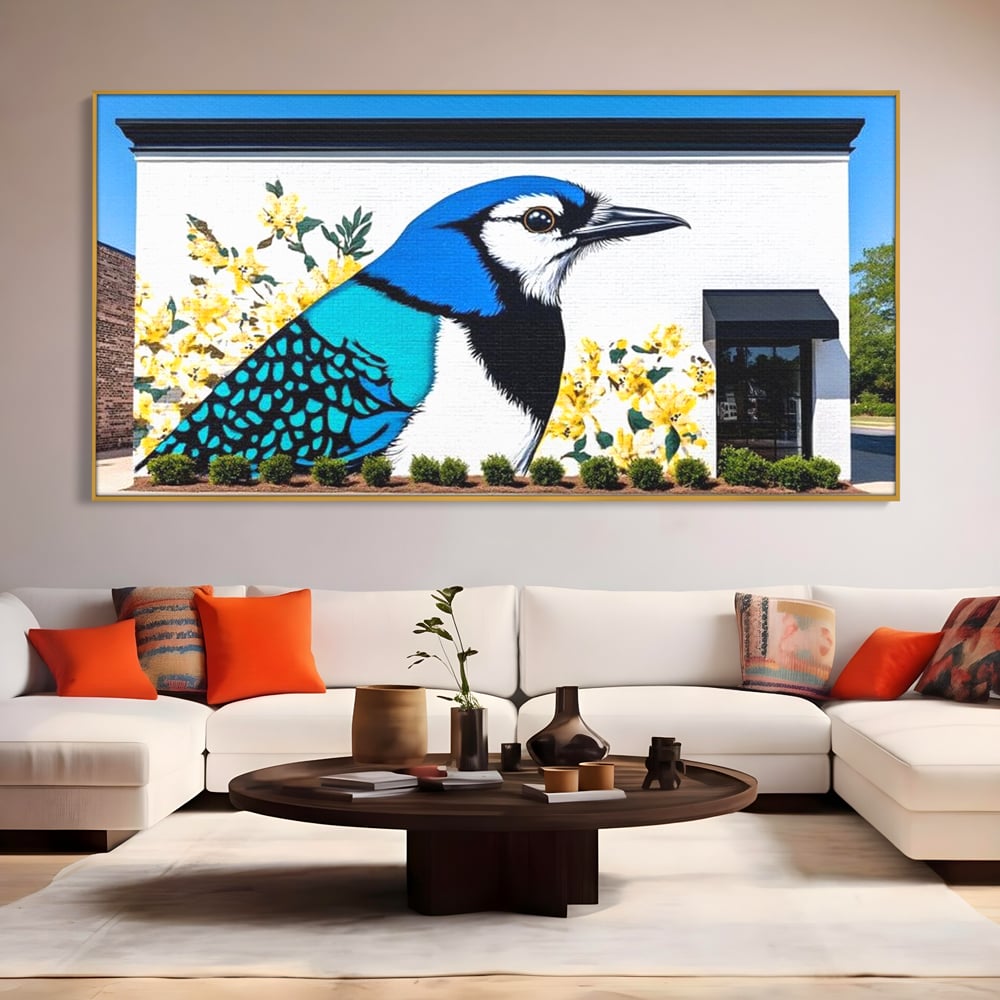 Tablou canvas cu tablou canvas cu o pasare murala si flori galbene, in rama de aluminiu auriu, pe perete intr-un living