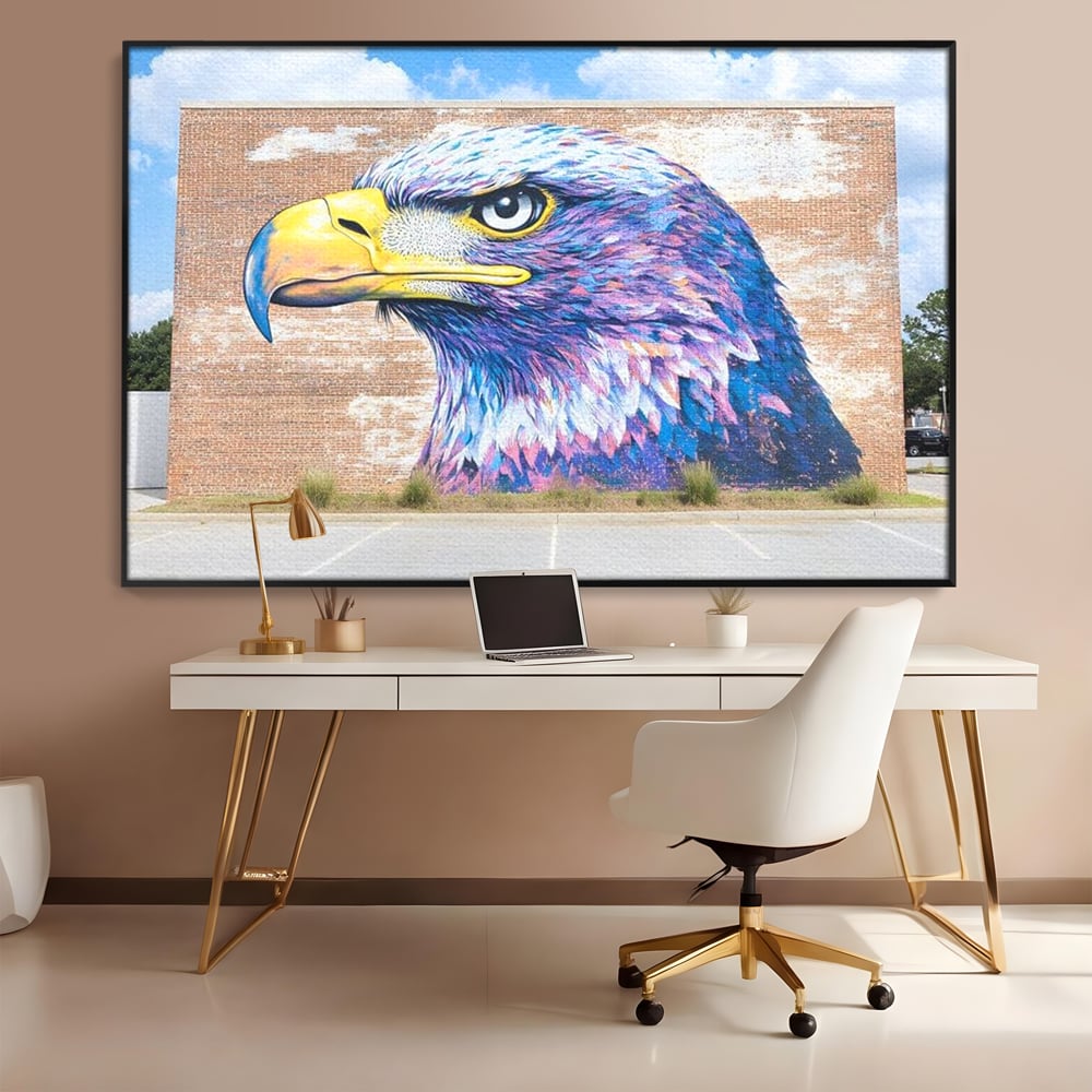 Tablou canvas cu tablou canvas cu vultur graffitti pe zid de caramida, in rama de aluminiu negru, pe perete intr-un birou