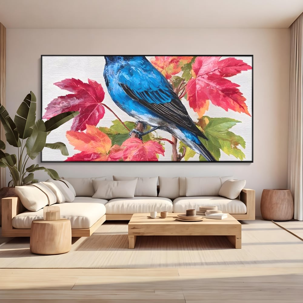 Tablou canvas cu tablou canvas cu pasare albastra si frunze de toamna, in rama de aluminiu negru, pe perete intr-un living