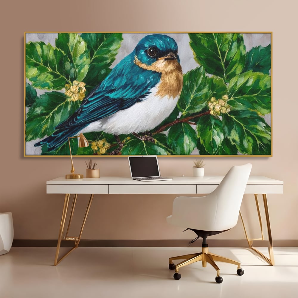 Tablou canvas cu tablou canvas cu pasare albastra printre frunze, in rama de aluminiu auriu, pe perete intr-un birou
