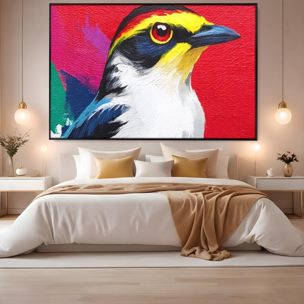 Tablou canvas cu tablou canvas cu pasare colorata in profil, in rama de aluminiu negru, pe perete intr-un dormitor
