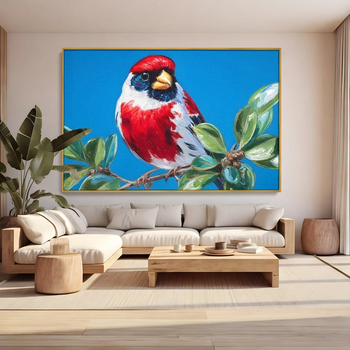 Tablou canvas cu tablou canvas cu pasare pe ramura, in rama de aluminiu auriu, pe perete intr-un living