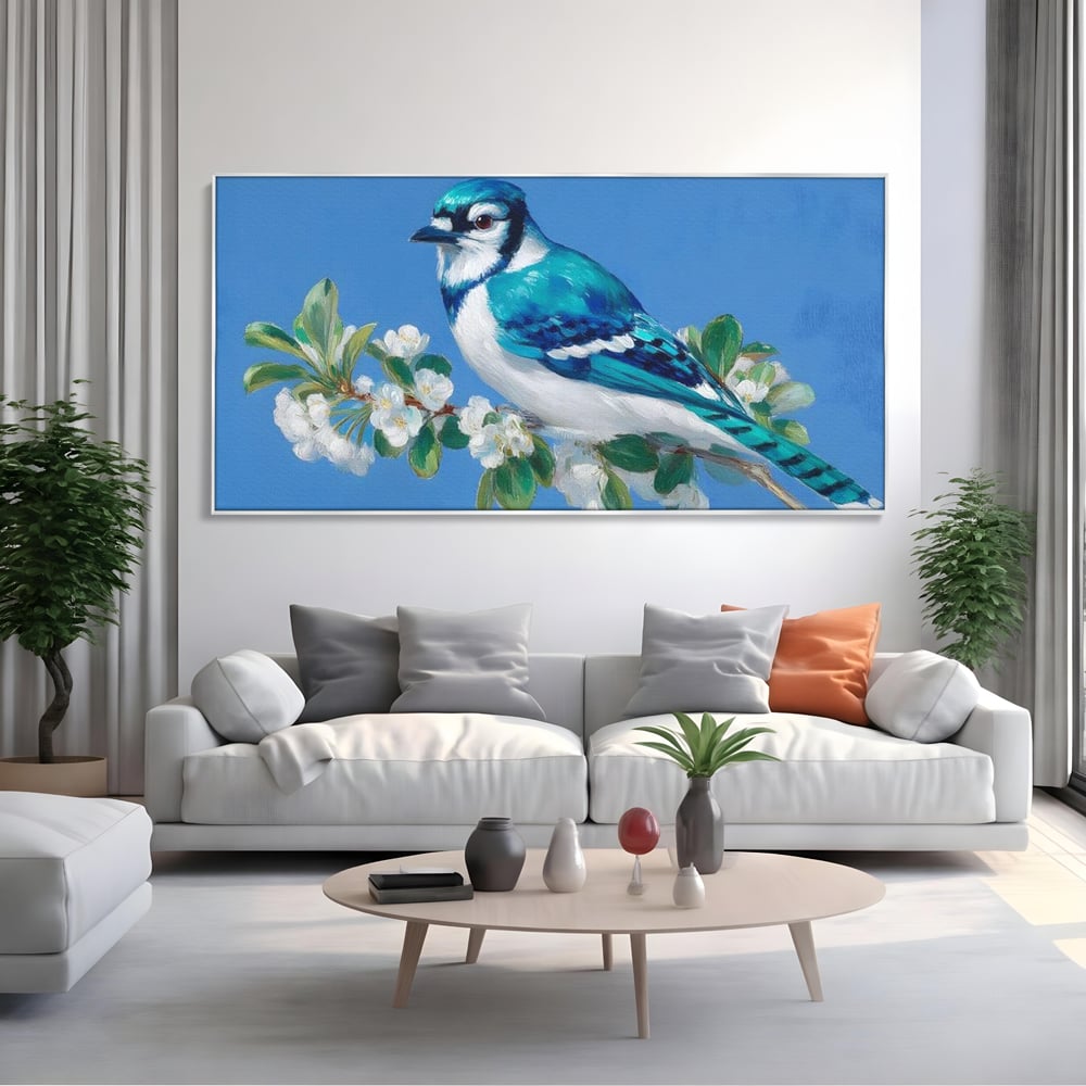 Tablou canvas cu tablou canvas cu gai albastra pe ramura, in rama de aluminiu argintiu, pe perete intr-un living