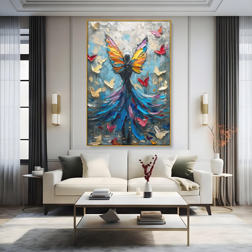 Tablou canvas cu tablou canvas cu femeie si aripi de fluture, in rama de aluminiu auriu, pe perete intr-un living