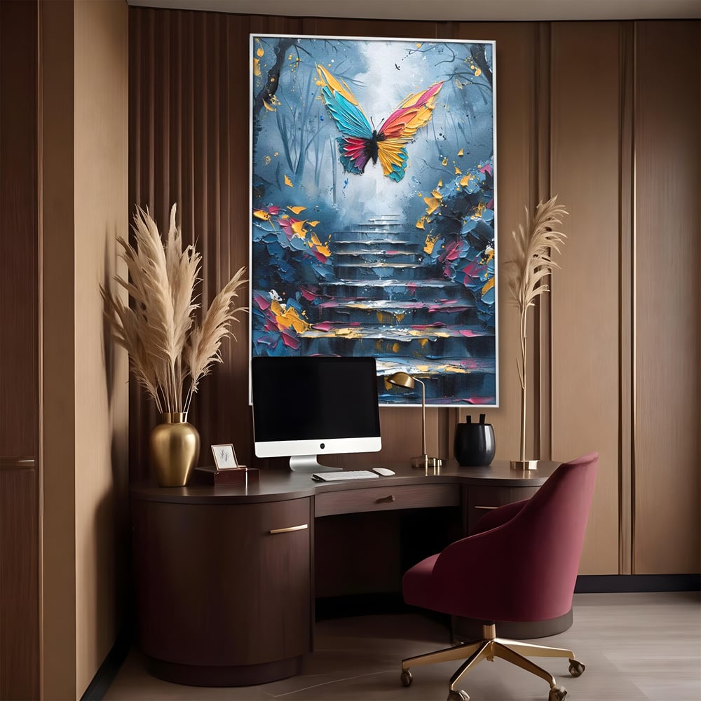Tablou canvas cu tablou canvas cu fluture multicolor si scari, in rama de aluminiu argintiu, pe perete intr-un birou