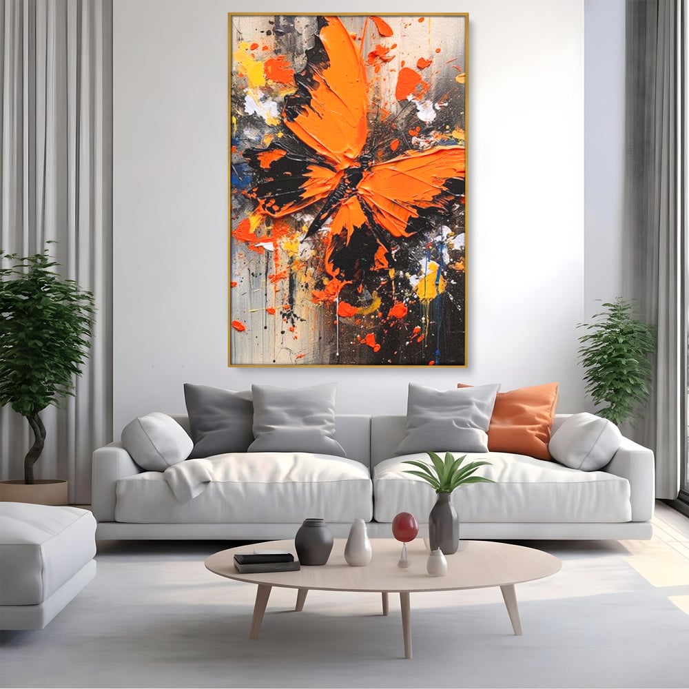 Tablou canvas cu tablou canvas cu fluture portocaliu pe fundal antracit, in rama de aluminiu auriu, pe perete intr-un living