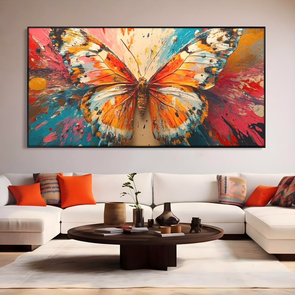 Tablou canvas cu pictura canvas cu fluture portocaliu pe fond cromatic, in rama de aluminiu negru, pe perete intr-un living