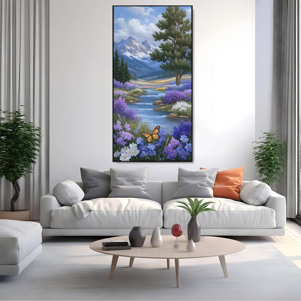Tablou canvas cu tablou pictura peisaj montan cu rau si flori, in rama de aluminiu negru, pe perete intr-un living